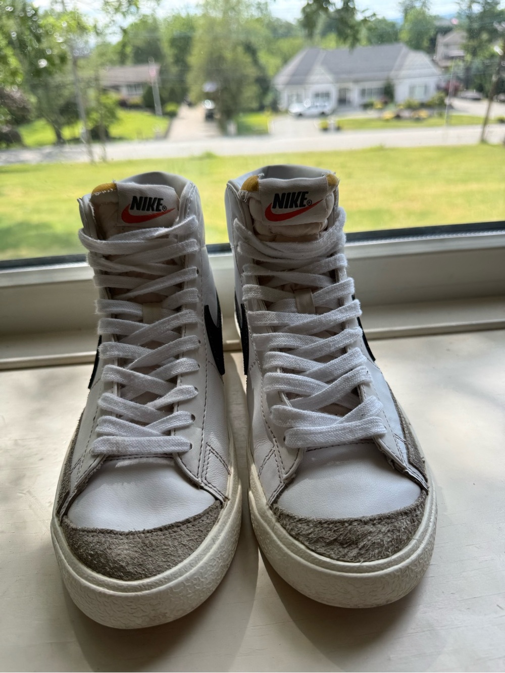 Nike White High-Top Sneakers with Black Swoosh and Gray Suede Accents